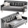 Gray Leather Sofa with Tufted Backrest Patterned Pillows Throw Blanket and Wooden Legs