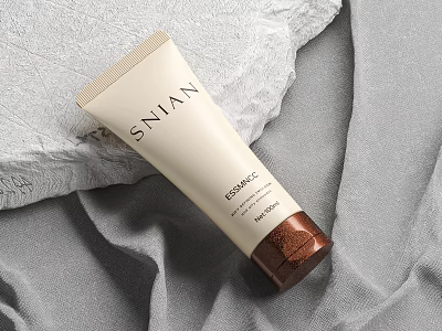 SNIAN KERAMIC Perfume Cosmetic Tube Beige And Brown Placed On Grey Fabric And Stone Surface 3d model