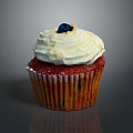 Delicious Red Cupcake With White Creamy Frosting Blueberry Topping And Textured Paper Liner