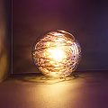 Multiple Sizes Spherical Wire Wrapped Decorative Lights With Warm Glow On Purple Background
