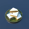 Fresh Tasty Square Shaped Cakes with White Frosting on Green Plate