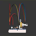 Microcontroller Circuit Board With Colored Wires Connected Electronic Components On White Base 3d model