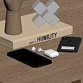 Modern Smartphones And Wireless Earbuds On Wooden Table With Humility Book Decor