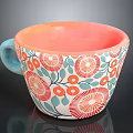 Colorful Ceramic Mug with Orange Interior Blue Handle and Red Floral Green Leaf Patterns