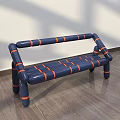 Navy Blue Public Bench With Orange Stripes And Tubular Structure On Wooden Floor Against Wall