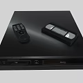 Modern Black Entertainment Media Player With Remote Control And Cassette Tape On Top