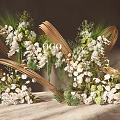 Elegant Floral Arrangement With Golden Curved Decorations And White Green Flowers