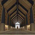 Spacious Hall Interior With Wooden Ceiling Dark Beams Decorative Panels Long Corridor And Central Window
