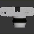 Vintage Retro Camera With Silver Body Wooden Panels And Classic Lens
