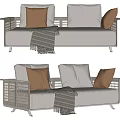 Rattan Frame Outdoor Sofa With White Cushions Brown Pillows And Striped Throw