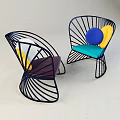 Modern Leisure Chairs Featuring Black Metal Frame Colorful Cushions And Circular Decorations