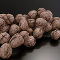 Organic Fresh Walnuts in a Pile on Black Background with Natural Shell Texture