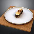 Layered Dessert On White Plate With Wooden Mat And Crunchy Topping