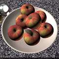Juicy Fresh Red and Yellow Apples on a White Plate Over Speckled Countertop