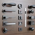 Assorted Modern Door Handles Displayed on Wooden Panel with Stylish Designs 3d model