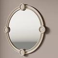 Round Decorative Mirror With Light Colored Frame Mounted On Beige Wall Near Vertical Striped Panels