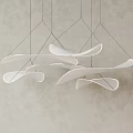 Modern White Curved Leaf Shaped Pendant Light Hanging in Minimalist Interiors