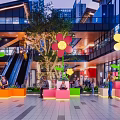 Popular Mall Photo Check in Spot With Colorful Seats Large Flower Decorations And Green Plants