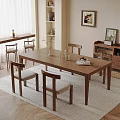 Elegant Dining Space With Wooden Table Chairs Vase Glassware Cabinet Artwork And Plant