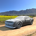 Stunning Silver Muscle Car Parked On Scenic Dirt Road With Yellow Flower Field And Mountains