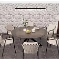 Outdoor Patio Round Table With Woven Chairs Brick Wall Table Lamp And Greenery