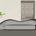 Modern Three Seater Sofa With White Upholstery Curved Brown Frame And Potted Plant Floor Lamp