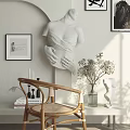 Wicker Leisure Chair In Modern Interior With Decorative Sculpture Vase And Sunlight