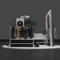 Stylish Window Display with White Racks Hanging Clothes Green Plants and Brand Logo