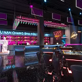 Modern Jeans Lounge Bar With Live Band Stage Purple Blue Lighting And Tables