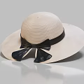 Classic Ivory Wide Brim Straw Hat Adorned With Black Bow Detail