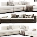 Beige Fabric Double Sofa With Checkered Pillows Cozy Throw Blanket And Ottoman