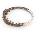 Antique Copper Colored Metal Circular Equipment With Decorative Spikes And Details