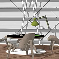 Modern Round Black Table with Woven Chairs and Green Desk Lamp in White Shelf Setting