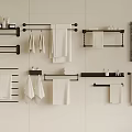 Modern Bathroom Accessories Featuring Towel Racks Shelves And Hanging Towels On White Wall