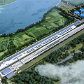 Aerial View Planning of Riverfront Green Fields with Train Station and Blue Storage Tanks