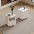 Modern White Bedside Tables With Drawers And Decorative Plants On Carpet