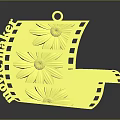 Golden film reel shaped decorative household item with flower patterns