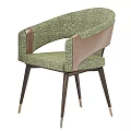 Green Fabric Leisure Chair With Brown Leather Armrests And Dark Legs With Gold Accents