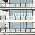 Modern Home Balcony Design Featuring Glass Railing Multiple Floors And Interior Furniture