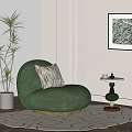 Green Single Sofa With Throw Pillow And Side Table Near Plant And Wall Art