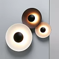 Modern Minimalist Round Wall Lamps With Black Dots On Gray Wall And Soft Edge Glow