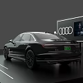 Sleek Black Audi A8L Sedan On Display Platform With Four Rings Logo And Screen