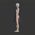 Woman with silver hair wearing blue pinafore dress and brown boots