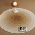 Round Carpet In Neutral Tones With Concentric Circle Pattern Mushroom Lamp And Open Magazine