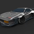 Silver Modified Sports Car With Streamlined Body Wide Tires And Rear Spoiler
