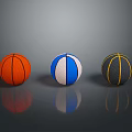 Three Colorful Household Basketballs in Orange Blue White and Black Yellow Hues with Reflections