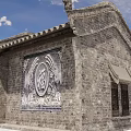 Traditional Ancient Architecture With Brick Wall Tiled Roof Ornate Eaves And Fortune Relief Design