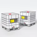 Two Industrial Equipment IBC Tanks With White Bodies Metal Frames Red Lids And Yellow Labels