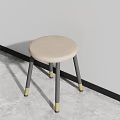 Beige Round Stool With Gray Legs And Gold Feet In Modern Interior