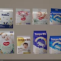 Display Of Various Baby Diaper Brands With Baby Images Rainbow And Cloud Designs